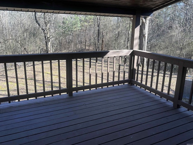 wooden deck featuring a wooded view