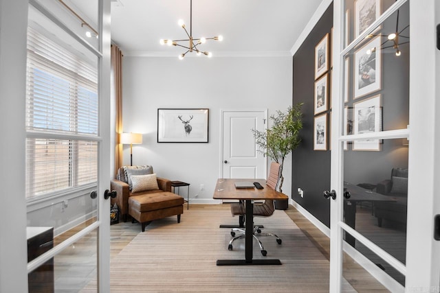 office area with baseboards, french doors, and crown molding