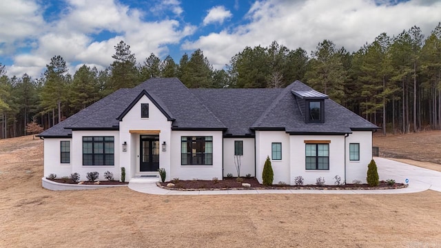 view of front of home featuring a shingled roof