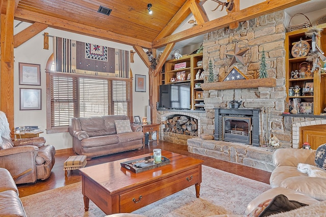 living area featuring high vaulted ceiling, wooden ceiling, a fireplace, wood finished floors, and built in features