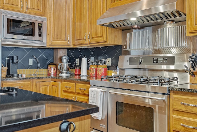 kitchen featuring stainless steel appliances, brown cabinetry, wall chimney exhaust hood, and tasteful backsplash