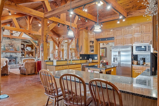 kitchen featuring a center island, stainless steel appliances, decorative backsplash, wood ceiling, and open floor plan