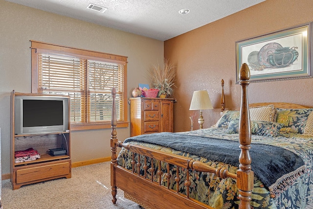 carpeted bedroom featuring a textured ceiling, a textured wall, visible vents, and baseboards