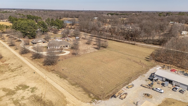 birds eye view of property featuring a rural view