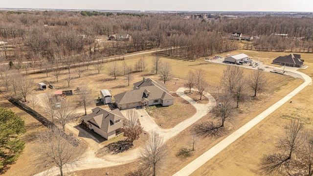 drone / aerial view with a view of trees and a rural view