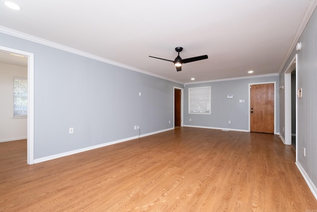 empty room with crown molding, recessed lighting, light wood-style flooring, a ceiling fan, and baseboards