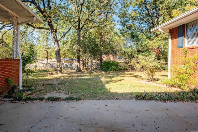 view of yard featuring a patio area and fence