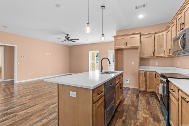 kitchen featuring electric range, visible vents, stainless steel microwave, dark wood-type flooring, and a sink