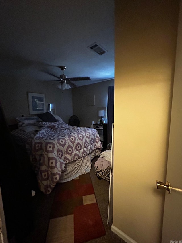 bedroom with visible vents and a ceiling fan