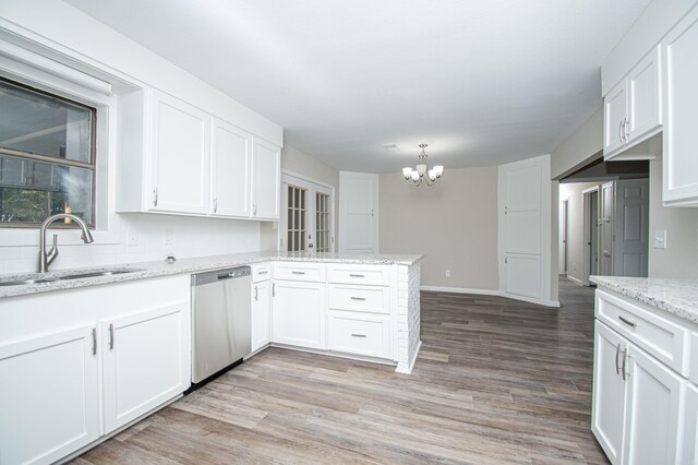 414 W Padgett Rd, El Dorado, AR 71730 - kitchen featuring white cabinets, a sink, a peninsula, and stainless steel dishwasher