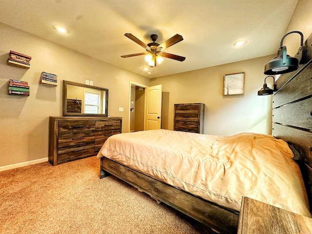 carpeted bedroom featuring ceiling fan, baseboards, and recessed lighting