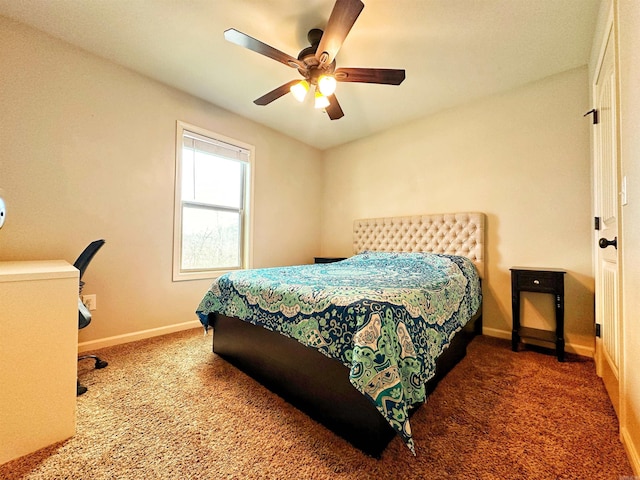 carpeted bedroom featuring ceiling fan and baseboards