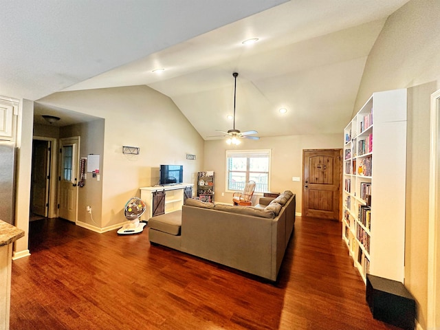 living area featuring dark wood-type flooring, vaulted ceiling, baseboards, and ceiling fan