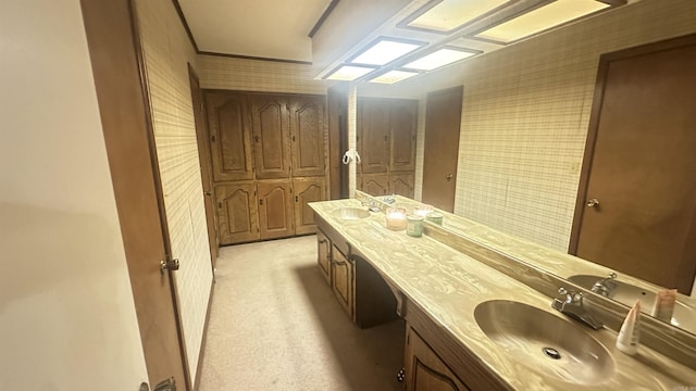 121 W Lee St, Mineral Sprs, AR 71851 - bathroom with double vanity, a sink, and wallpapered walls
