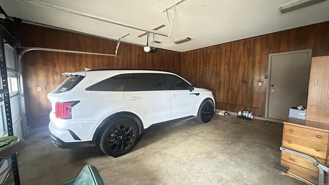 121 W Lee St, Mineral Sprs, AR 71851 - garage with a garage door opener and wooden walls