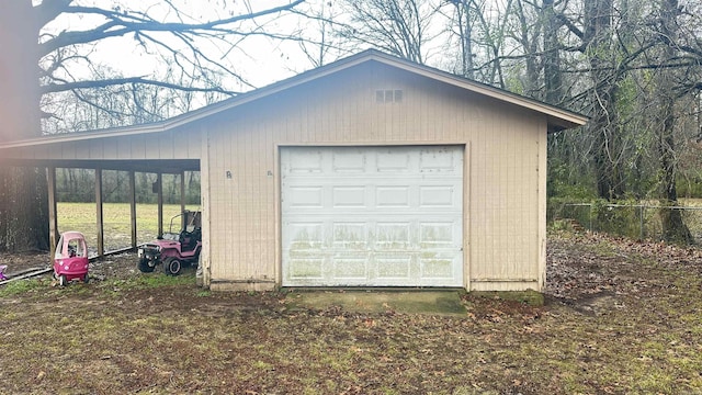 121 W Lee St, Mineral Sprs, AR 71851 - garage featuring a garage and fence