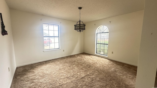 121 W Lee St, Mineral Sprs, AR 71851 - unfurnished room featuring carpet floors, baseboards, and a textured ceiling