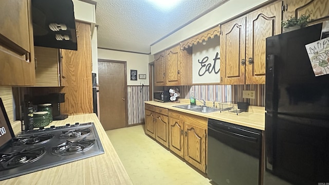 121 W Lee St, Mineral Sprs, AR 71851 - kitchen featuring a textured ceiling, a sink, light countertops, brown cabinets, and black appliances