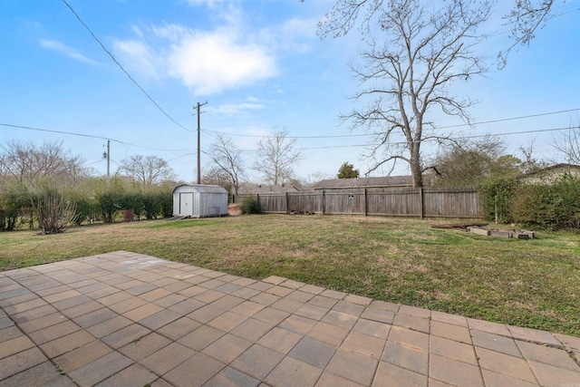 view of yard with a patio area, an outdoor structure, a fenced backyard, and a shed