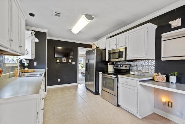 kitchen with appliances with stainless steel finishes, white cabinets, visible vents, and a sink