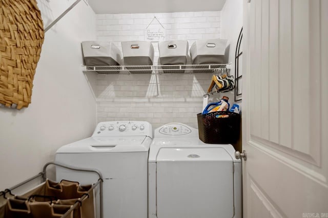 laundry area featuring laundry area and independent washer and dryer