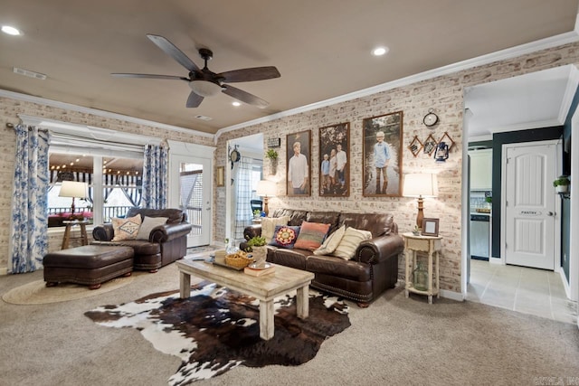 living area with recessed lighting, visible vents, tile patterned floors, carpet, and crown molding