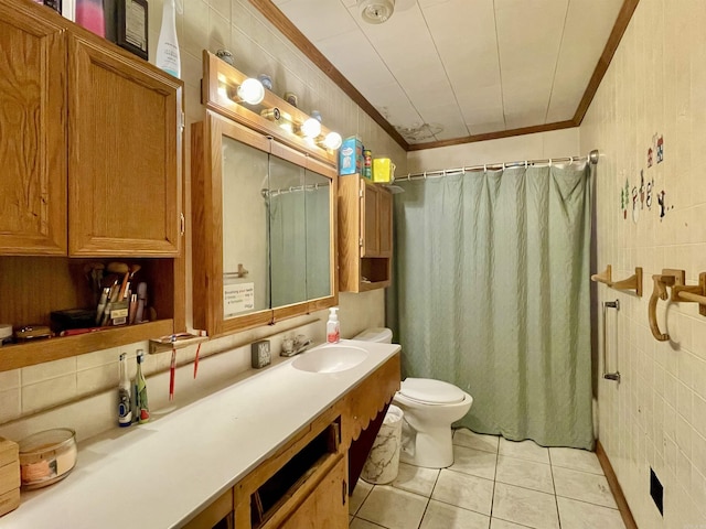 full bathroom featuring toilet, ornamental molding, tile patterned floors, vanity, and tile walls