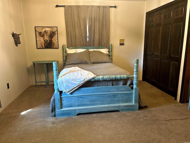 carpeted bedroom featuring a closet