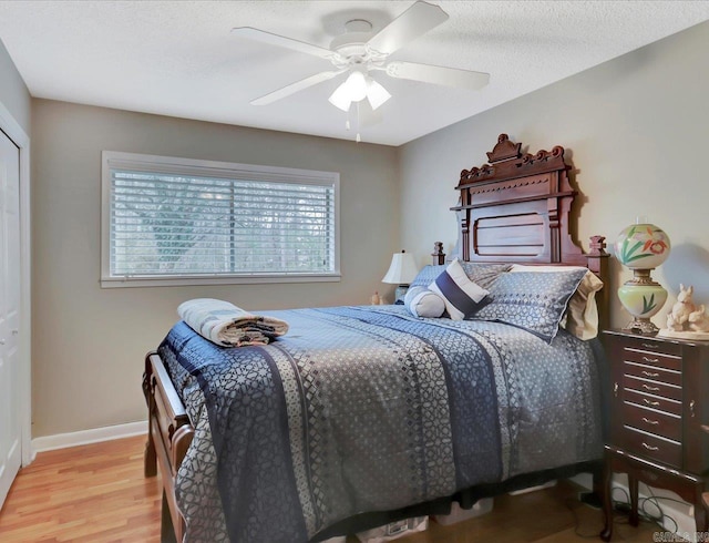 121 Chappel Hill Rd, Hot Springs, AR 71913 - bedroom featuring a textured ceiling, baseboards, ceiling fan, and wood finished floors