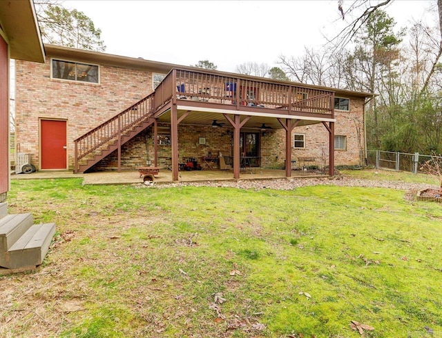 121 Chappel Hill Rd, Hot Springs, AR 71913 - back of house featuring stairway, fence, a lawn, brick siding, and a patio area