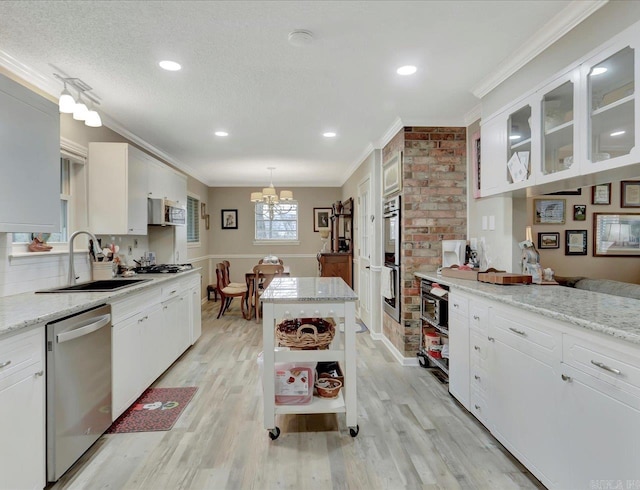 121 Chappel Hill Rd, Hot Springs, AR 71913 - kitchen featuring ornamental molding, appliances with stainless steel finishes, a sink, open shelves, and an inviting chandelier