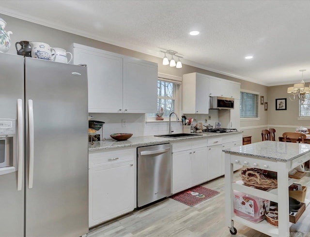 121 Chappel Hill Rd, Hot Springs, AR 71913 - kitchen with white cabinetry, a sink, stainless steel appliances, and a chandelier