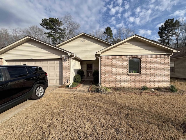 ranch-style home with concrete driveway, brick siding, and an attached garage