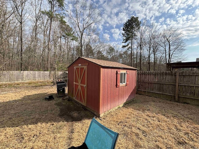 view of shed featuring a fenced backyard