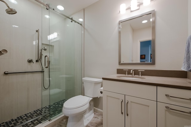 full bath with toilet, a stall shower, and vanity