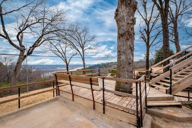 exterior space with a rural view and a wooden deck