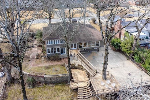 back of property featuring stairs