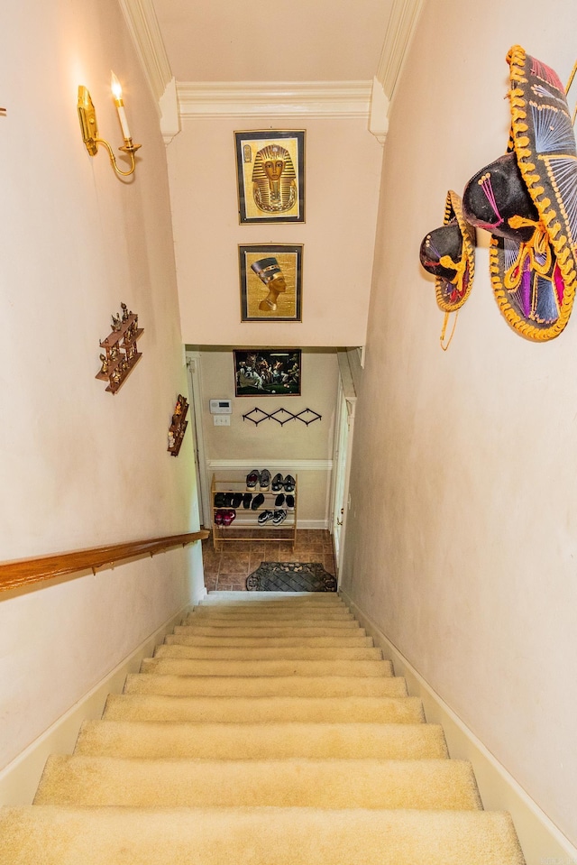 stairway featuring crown molding