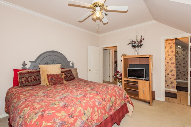 carpeted bedroom with connected bathroom, crown molding, baseboards, vaulted ceiling, and a ceiling fan