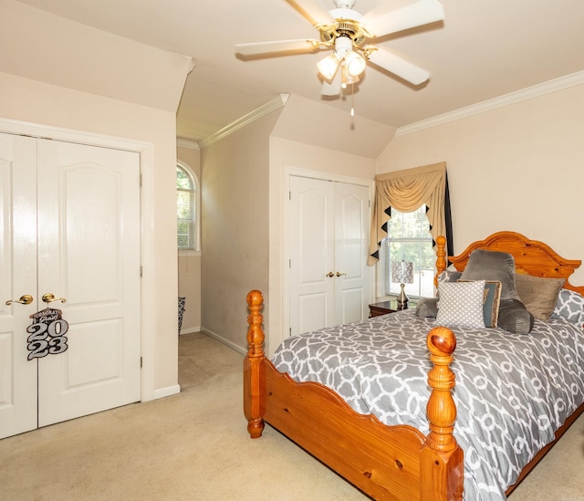 bedroom with multiple windows, carpet floors, and crown molding
