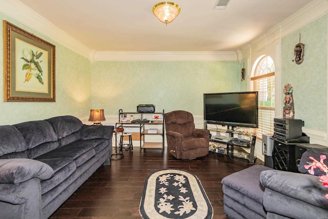living room featuring visible vents, ornamental molding, and wood finished floors