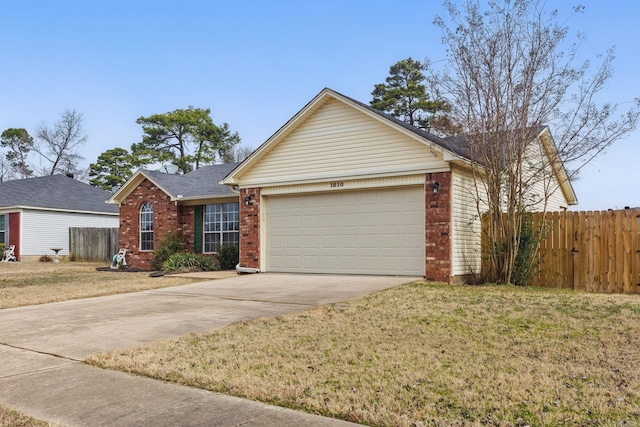 ranch-style house with a garage, fence, concrete driveway, and brick siding