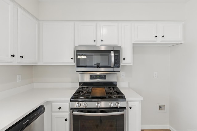 kitchen featuring white cabinetry, appliances with stainless steel finishes, and light countertops