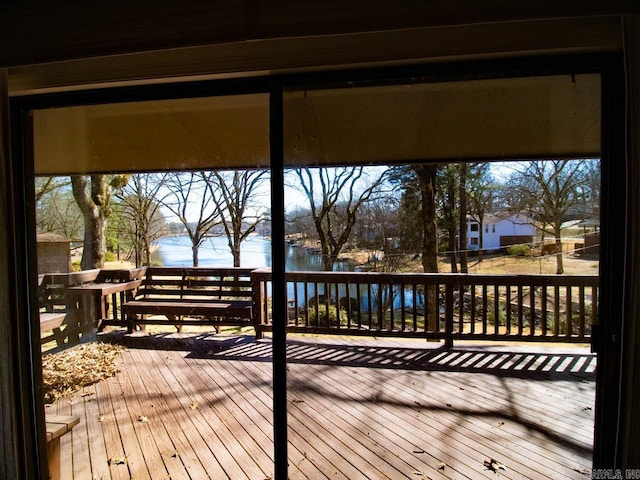 wooden terrace with a water view