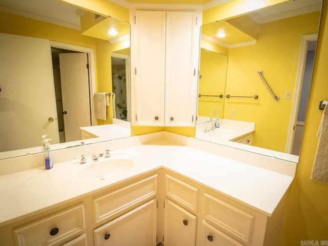 bathroom with ornamental molding and vanity