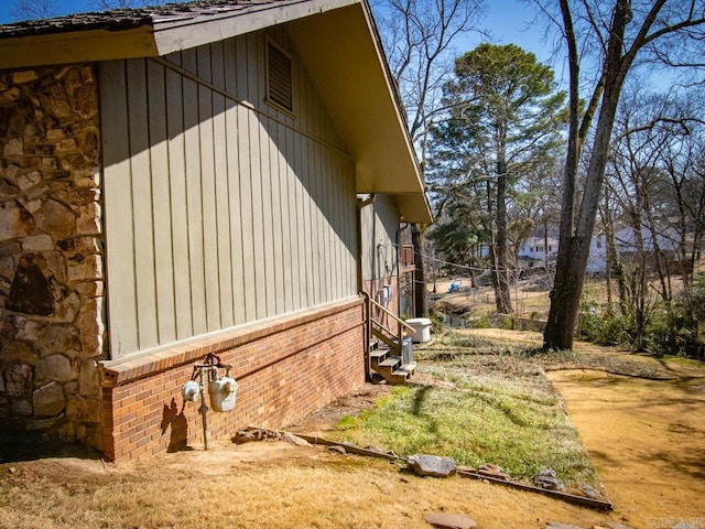 view of property exterior featuring brick siding