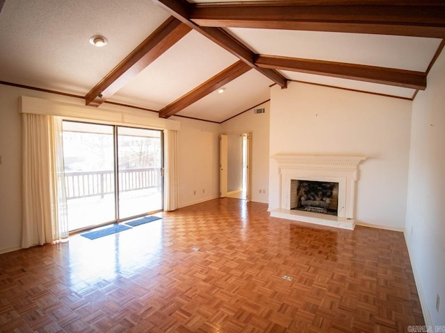 unfurnished living room with baseboards, visible vents, a fireplace with raised hearth, vaulted ceiling with beams, and a textured ceiling