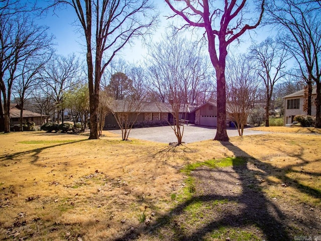 view of yard with a garage