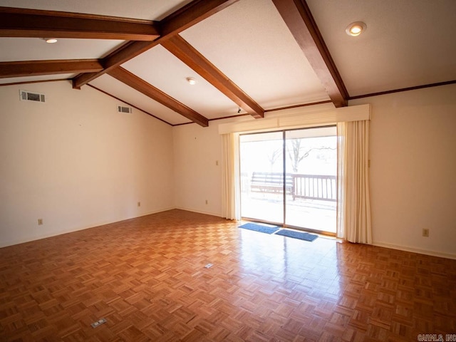 spare room with vaulted ceiling with beams, visible vents, and baseboards