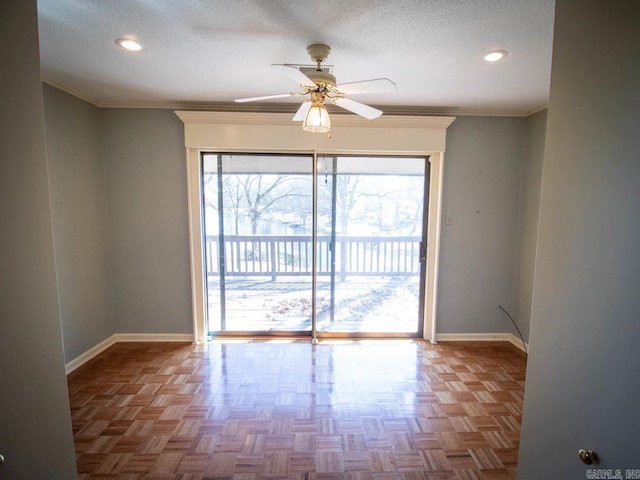 empty room featuring a textured ceiling, ceiling fan, recessed lighting, baseboards, and crown molding